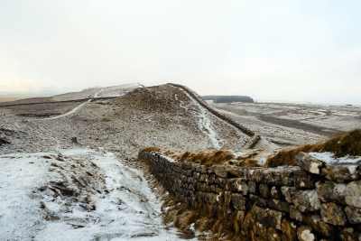 Hadrian's wall path with light snow on the ground