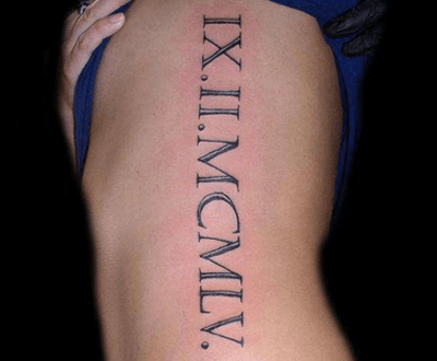 An example of a Roman numerals tattoo down the side of the body